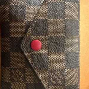 Louis Vuitton Victorine Wallet. Damier Ebene in red.